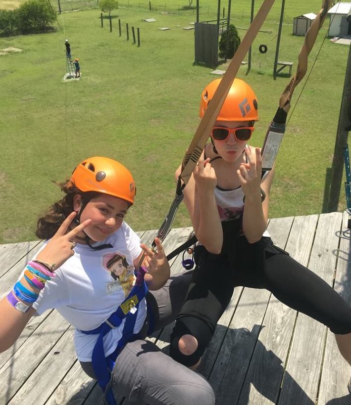 Summer leaderships camps girls getting ready to zipline