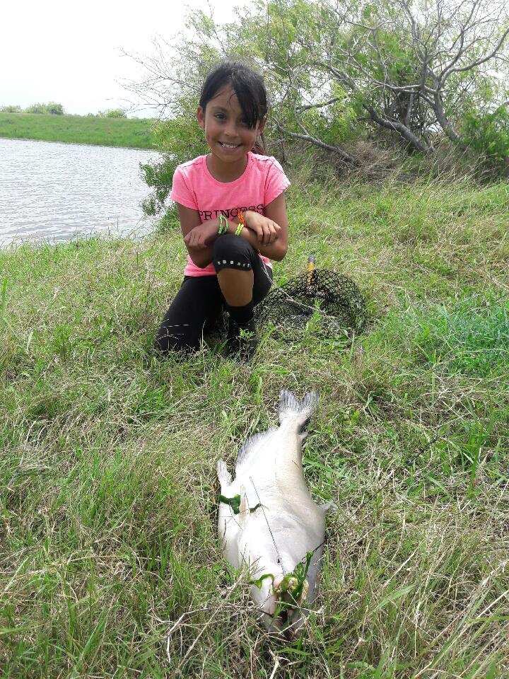 Living Local tiny girl with large catfish