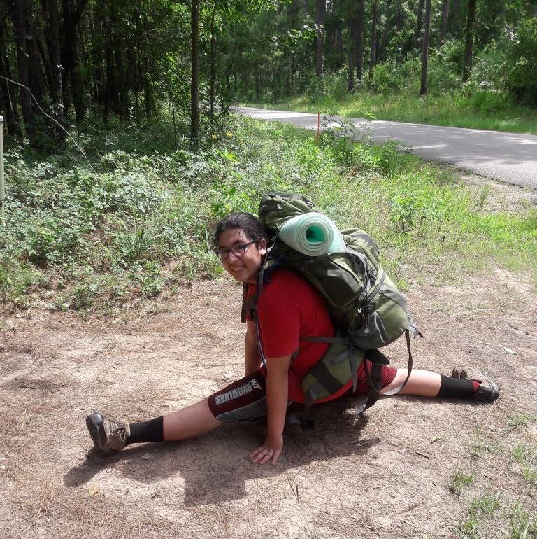 Youth Leader Donovan doing the splits at Backpacking camp 2017