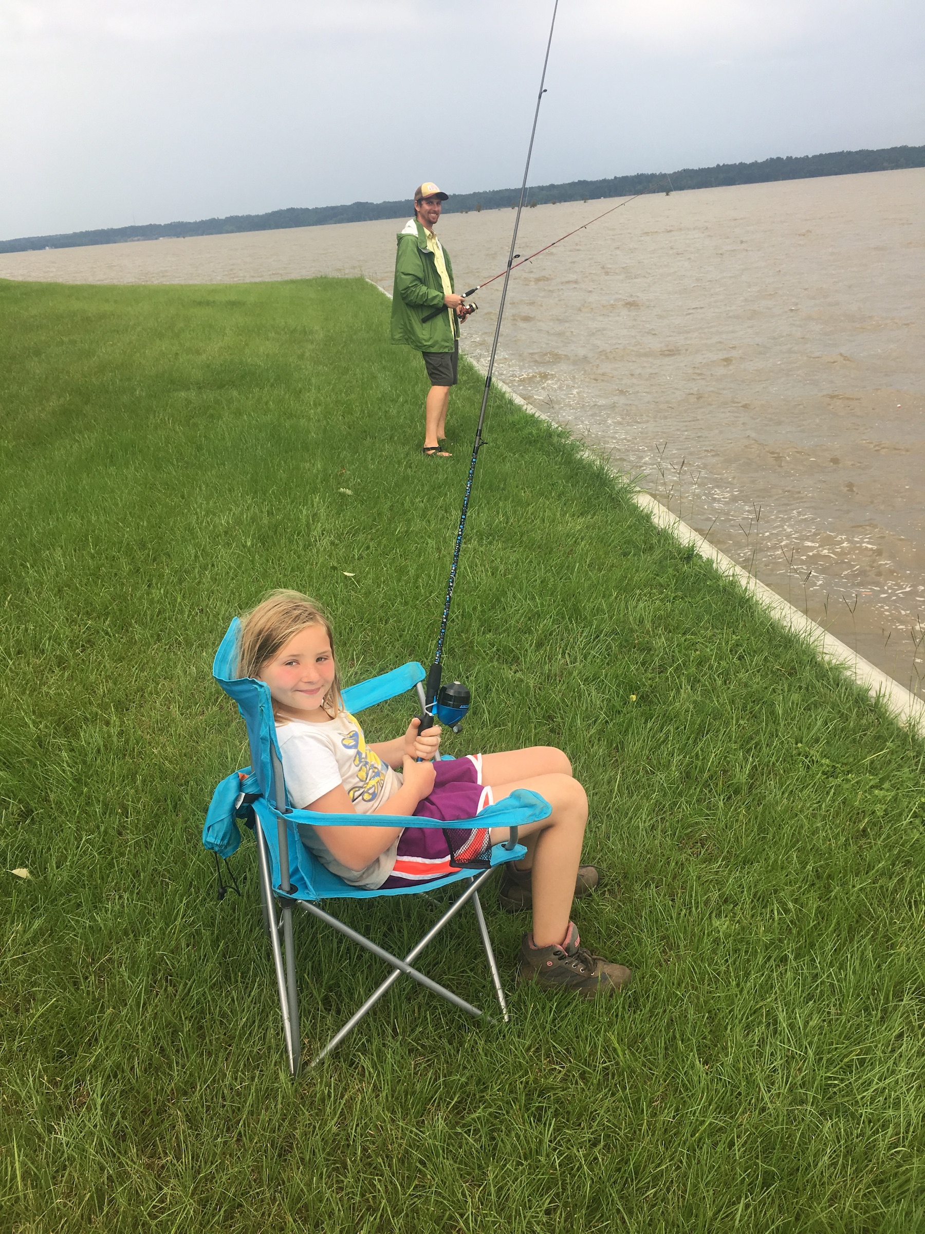 girl fishing at our summer leadership camp