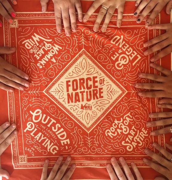 Girl's Empowerment campers hand on a bandana